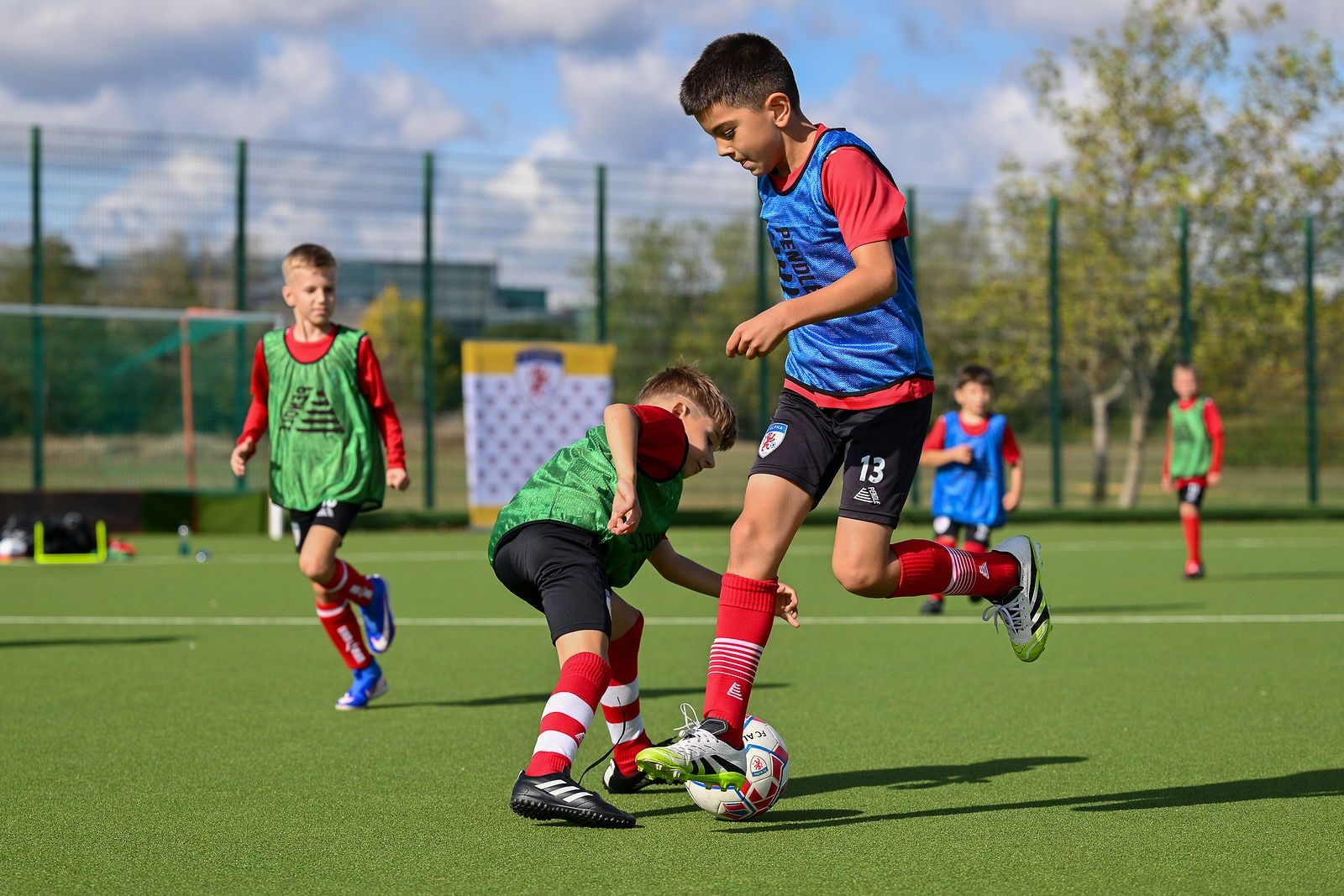 Two players competing for the ball in a training game