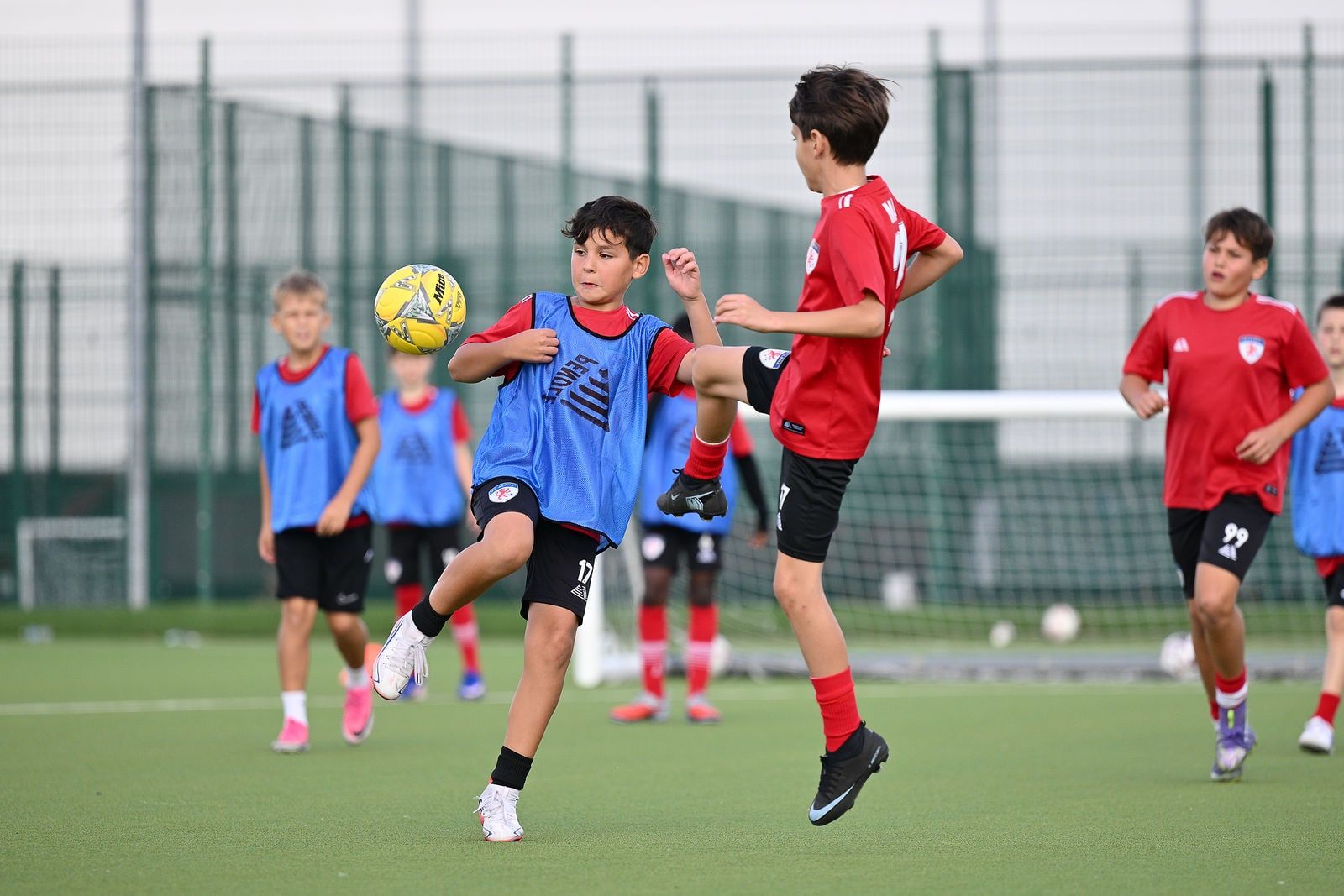 Under 12 players in a match drill at FC Alpha Academy, Basildon