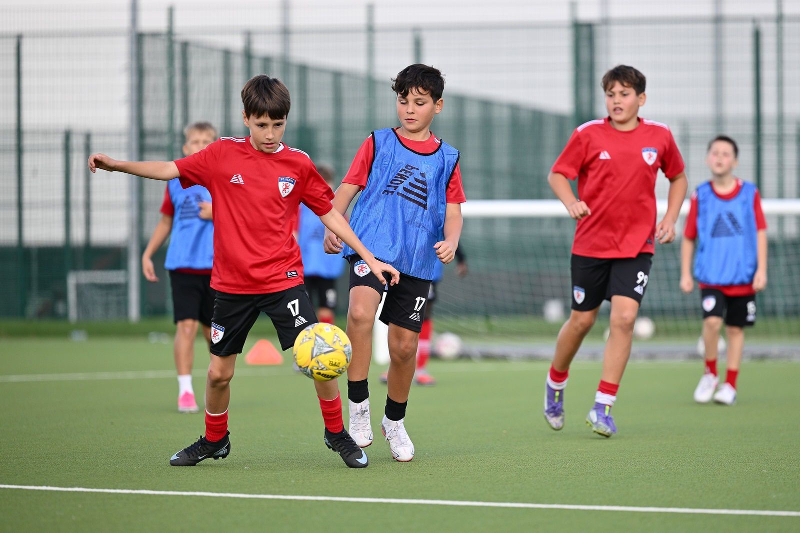 Under 12 players in a match drill at FC Alpha Academy, Basildon