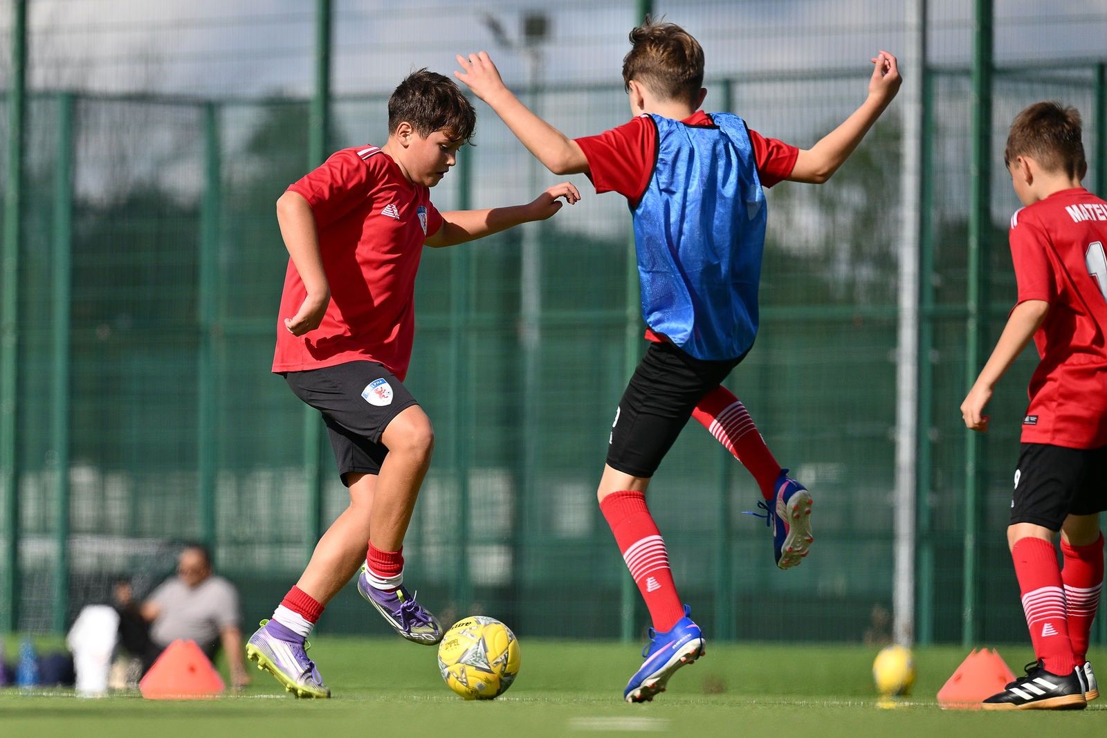 Under 12 players in a match drill at FC Alpha Academy, Basildon