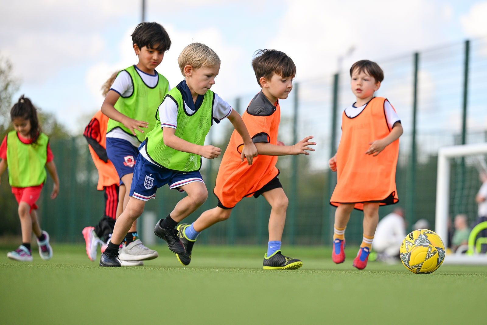 Under 6 children playing football at FC Alpha Academy, Basildon